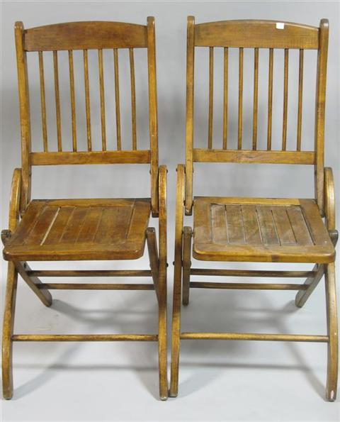 Appraisal: PAIR OF RUSTIC WOODEN FOLDING CHAIRS The plain crestrails joined