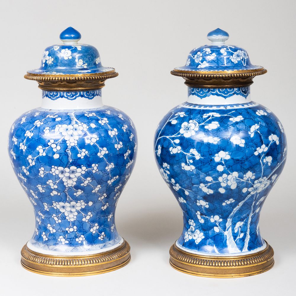 Appraisal: Near Pair of Gilt-Metal-Mounted Chinese Blue and White Porcelain Jars