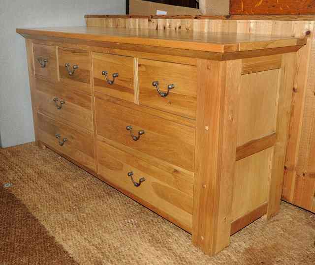 Appraisal: A CONTEMPORARY OAK LOW SIDEBOARD of four short and four