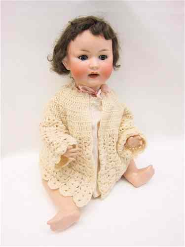 Appraisal: GERMAN BISQUE SOCKET HEAD TODDLER DOLL with chubby ball-jointed composition