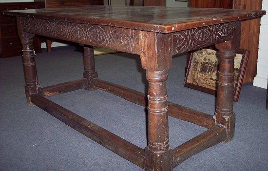 Appraisal: An oak rectangular refectory table the plain triple plank top