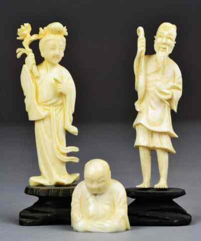 Appraisal: Chinese Carved Ivory FiguresThree carved ivory figures two having wooden