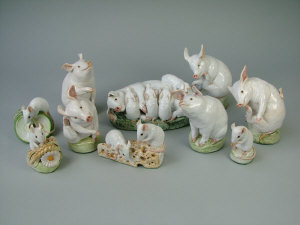 Appraisal: A selection of white glazed terracotta pigs piglets and field