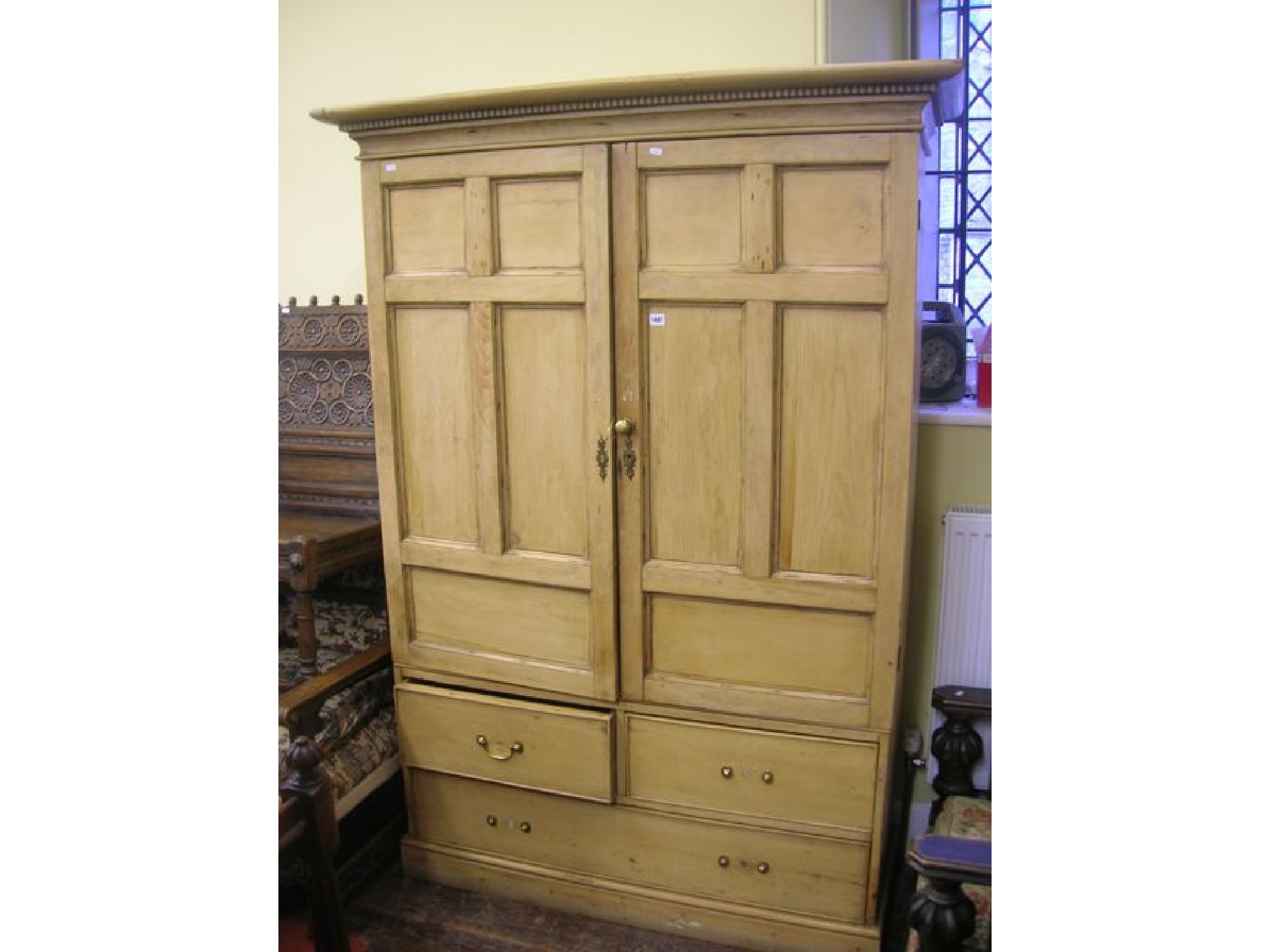 Appraisal: A Victorian stripped and waxed pine food housekeepers cupboard the