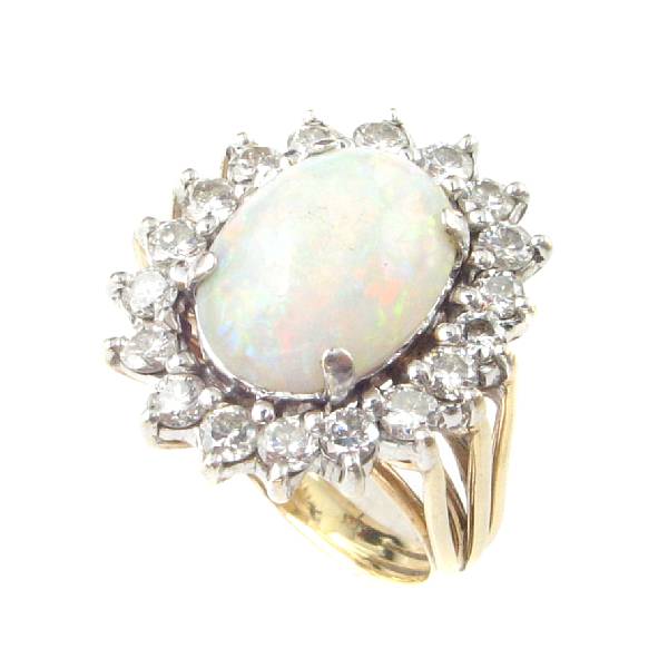 Appraisal: An opal diamond and gold cluster ring