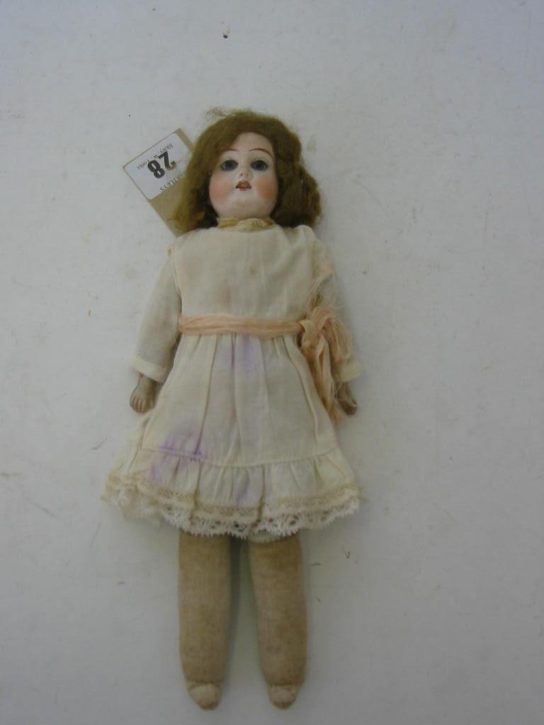 Appraisal: A German bisque shoulder head girl doll with fixed blue