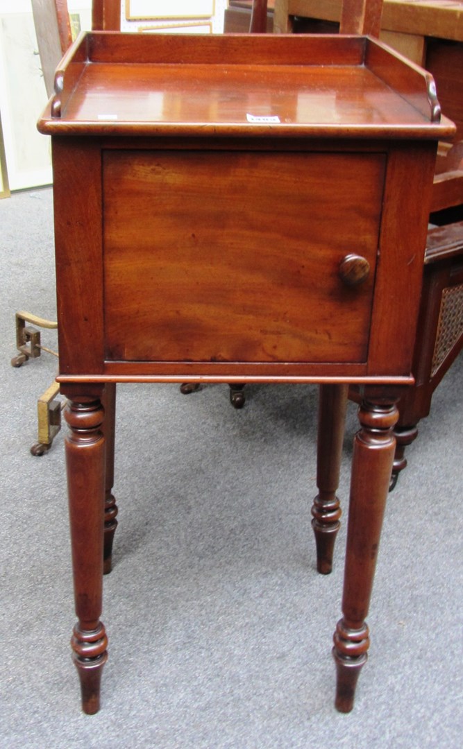 Appraisal: An early Victorian mahogany single door night stand on turned