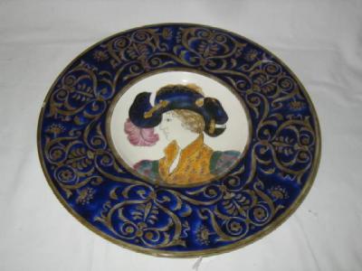 Appraisal: A FISCHER POTTERY PLAQUE of circular form the centre painted