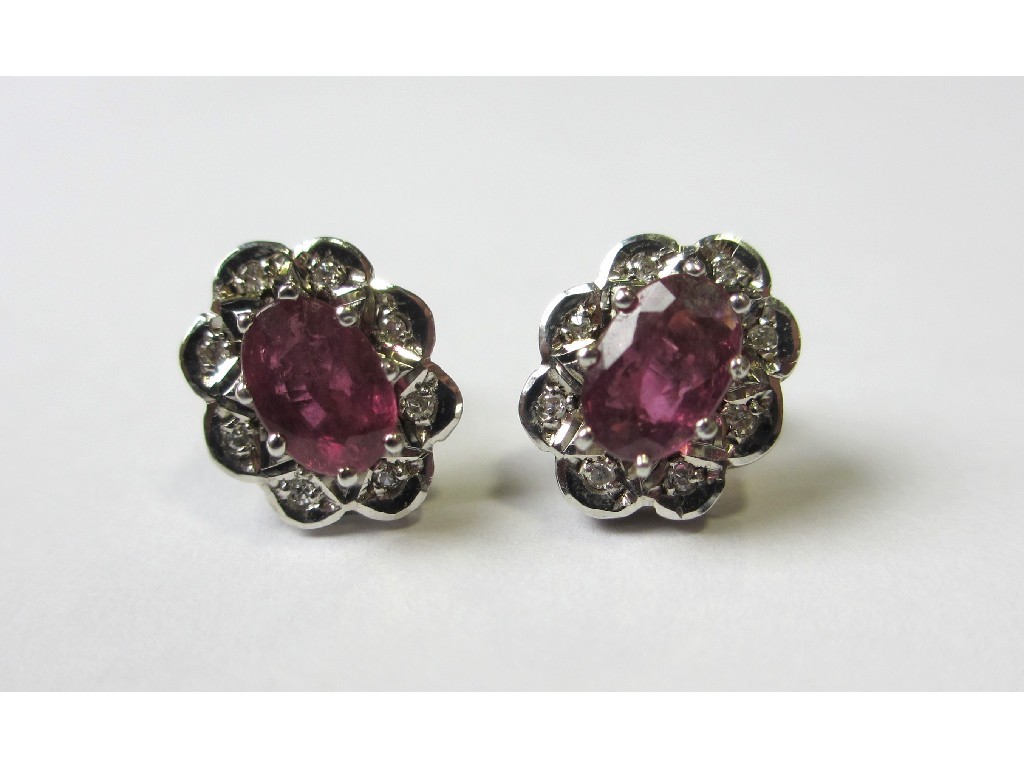 Appraisal: A pair of nine carat bi colour gold ruby and