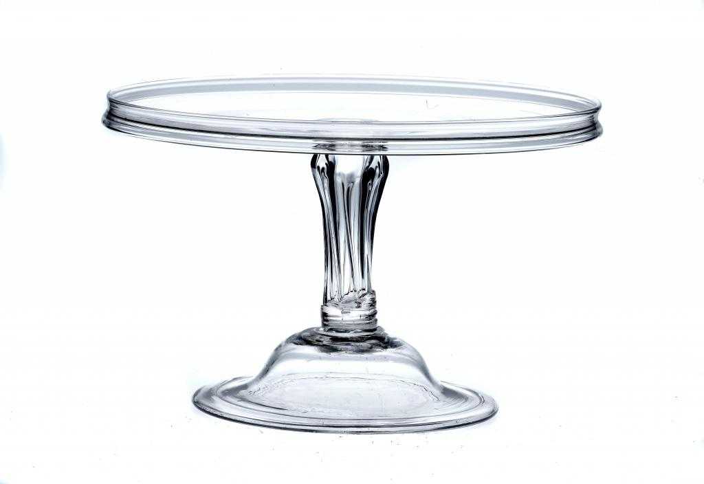 Appraisal: AN ENGLISH GLASS SALVER on moulded stem and folded foot