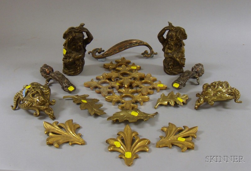 Appraisal: Eighteen European-style Cast Metal Furniture Mounts including figural brass gilt-metal