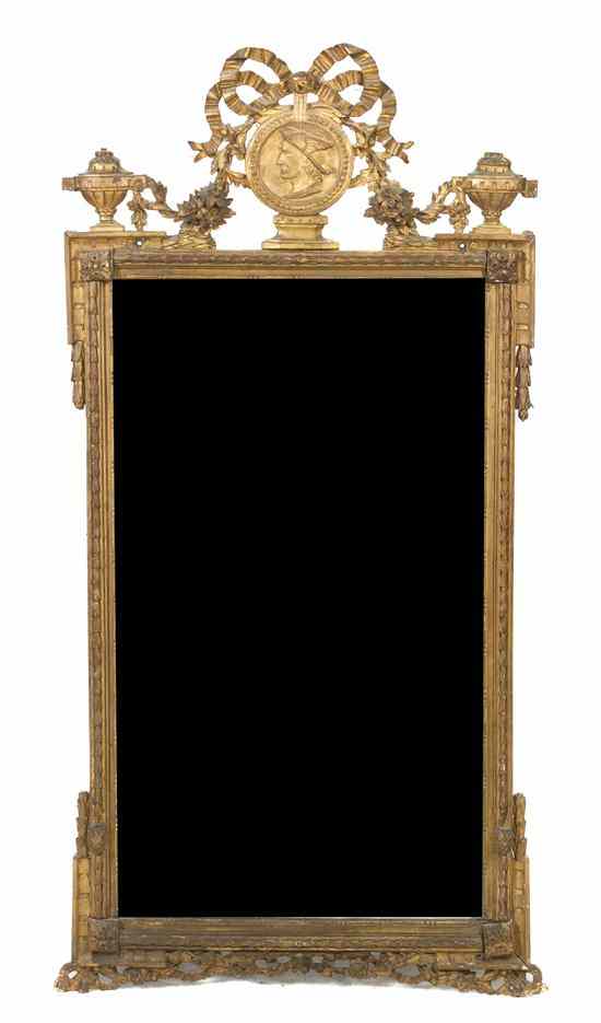 Appraisal: A Continental Giltwood Mirror having a ribbon-tied crest over a