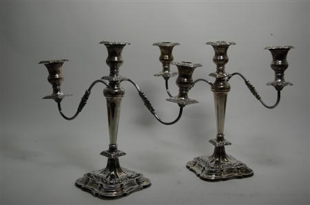 Appraisal: A pair of Regency style silver table candelabra Viners Sheffield