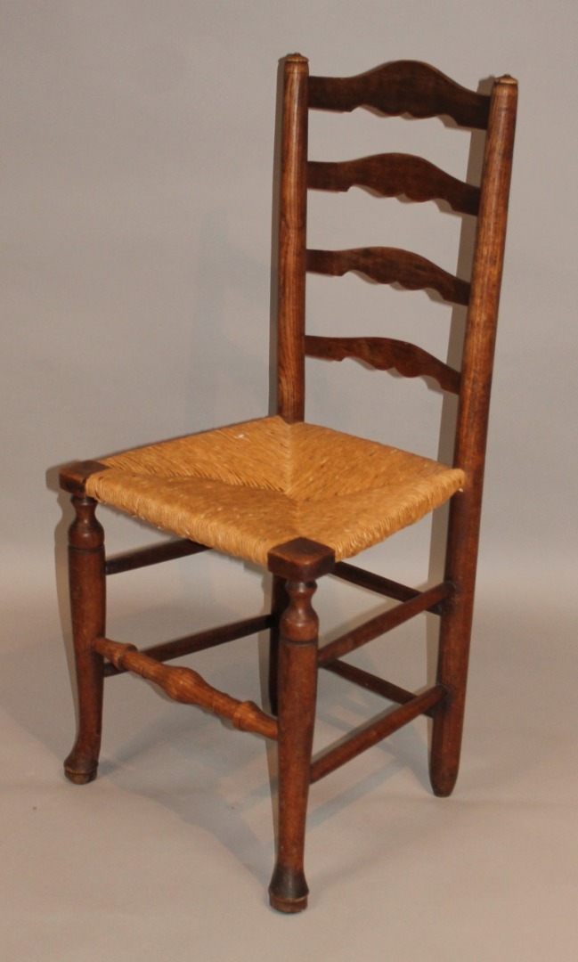 Appraisal: An thC ash ladderback chair with a rush seat raised