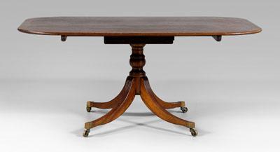 Appraisal: Regency style mahogany dining table banded mahogany top over turned