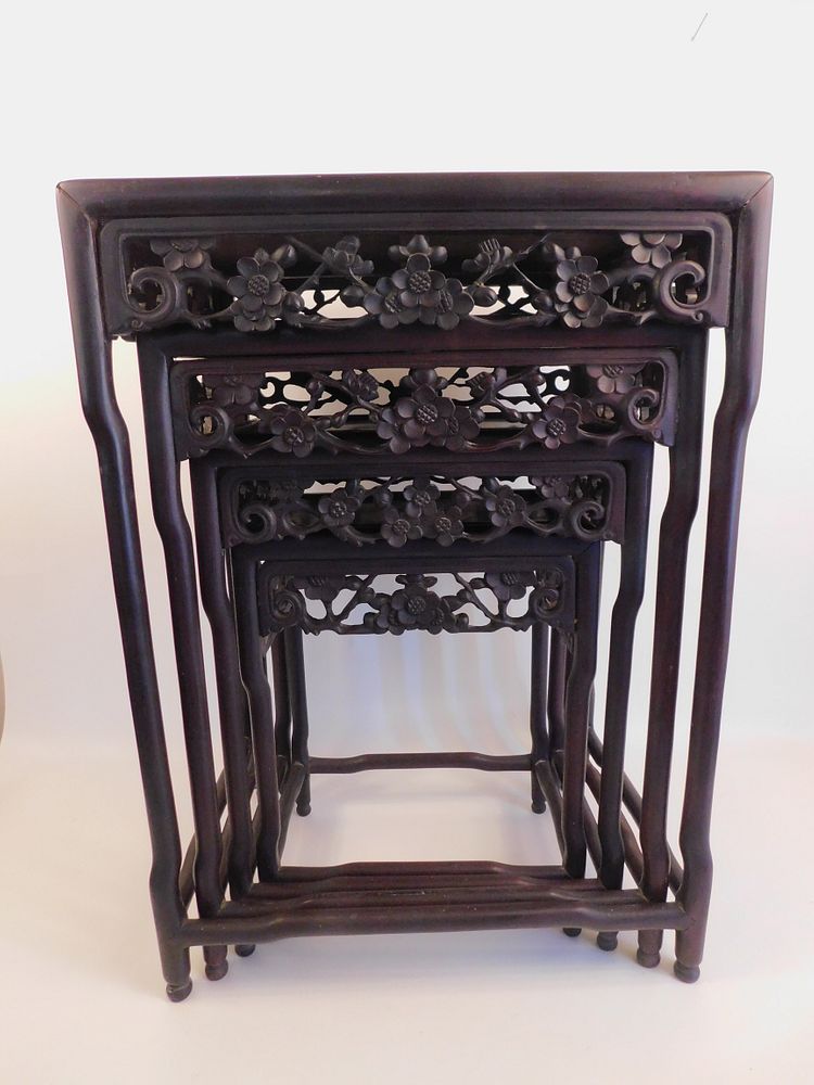 Appraisal: ANTIQUE CHINESE NESTING TABLES Set of graduated th century floral-carved