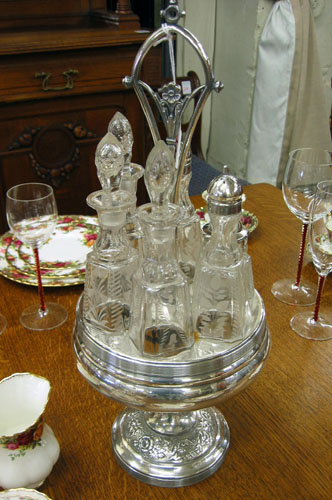 Appraisal: A VICTORIAN SILVERPLATED CASTER SET fitted on a revolving stand