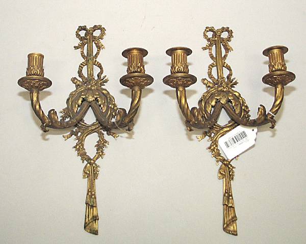 Appraisal: A pair of Neoclassical style gilt bronze two light bras