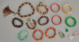 Appraisal: Group of Oriental jewelry to include eight hardwood and resin