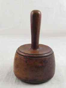 Appraisal: A wooden stone or wood carver's round mallet cm across