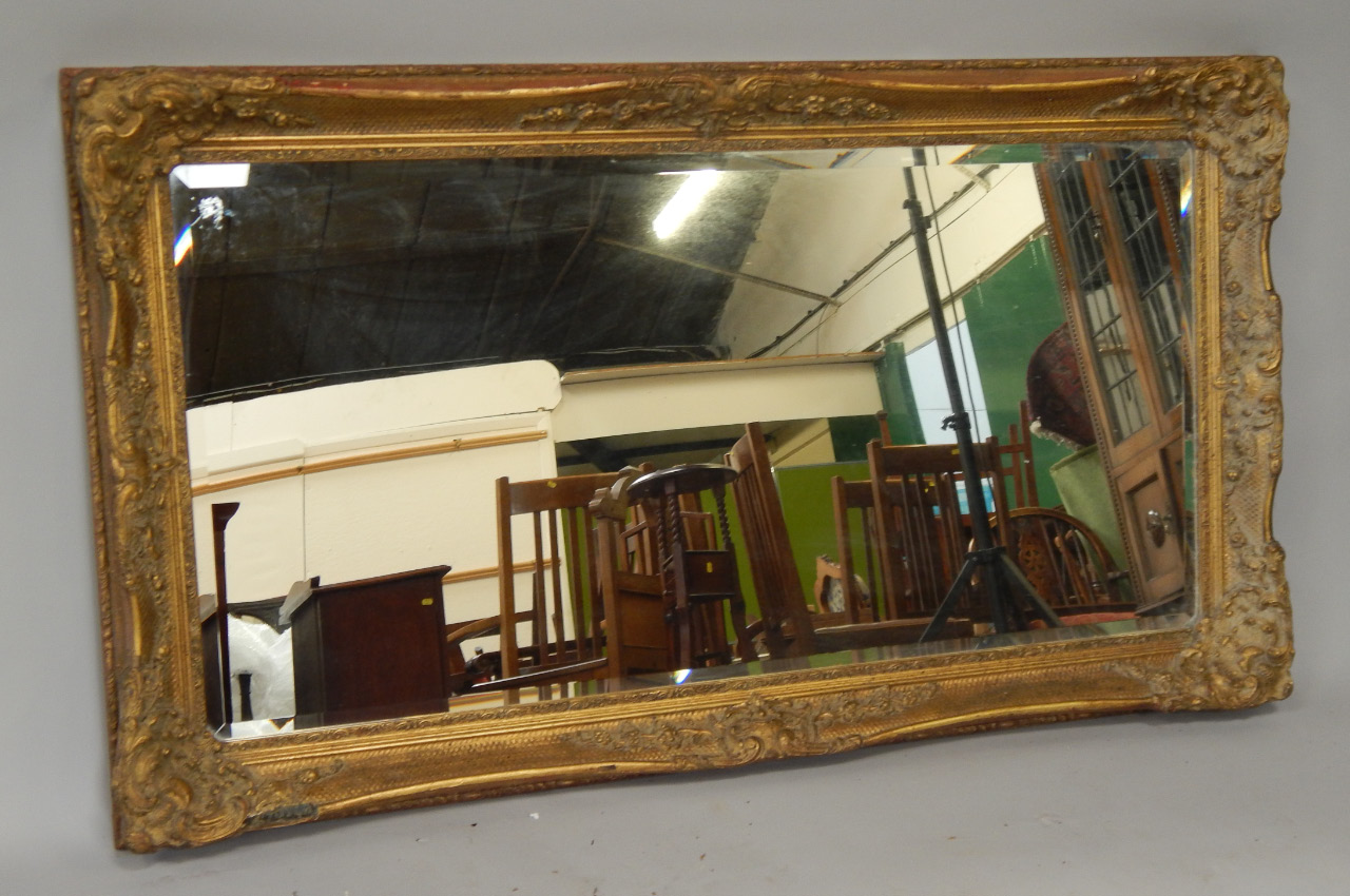 Appraisal: A large rectangular gilt framed bevel plate wall mirror