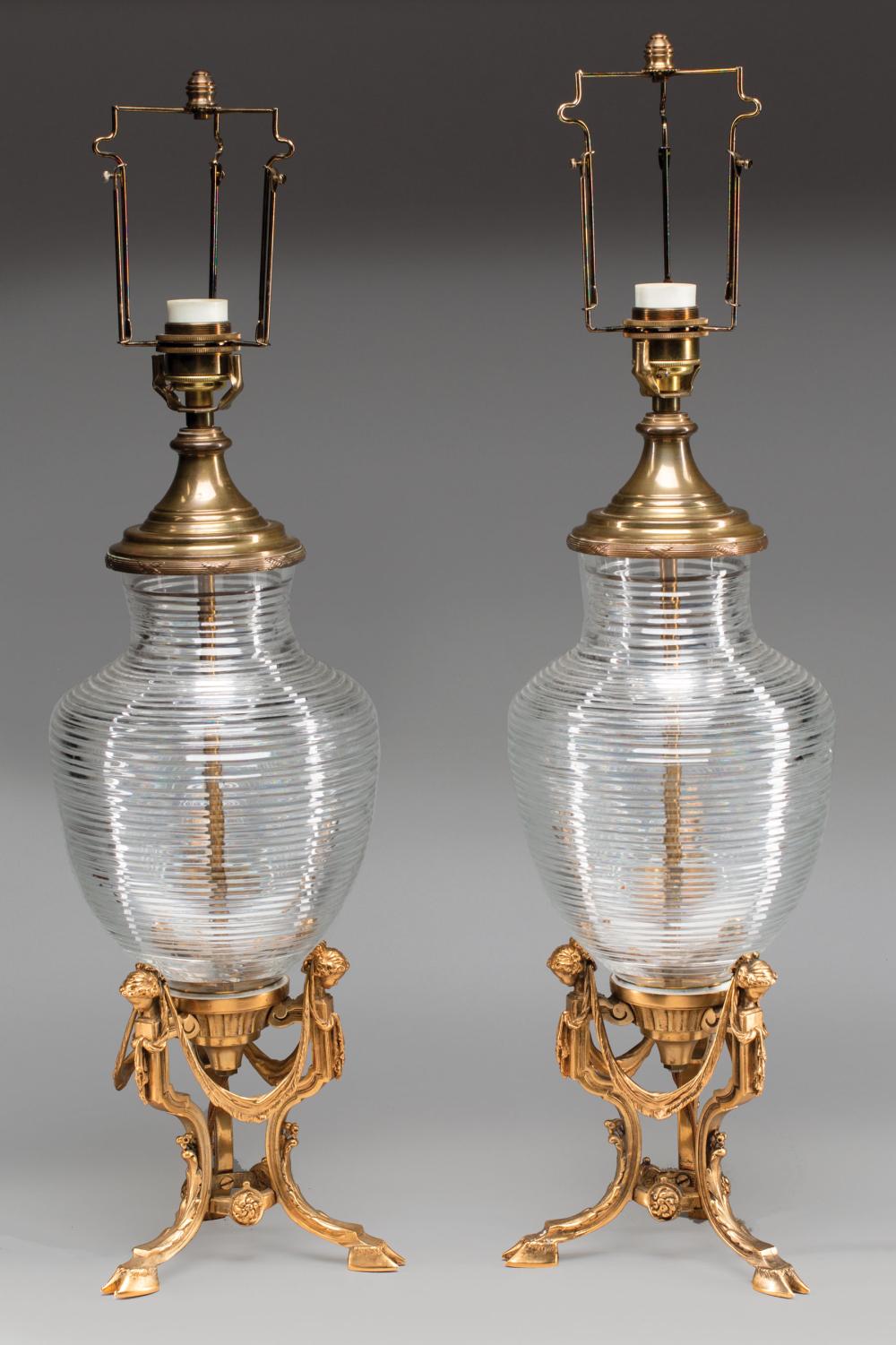 Appraisal: Pair of Louis XVI-Style Bronze and Crystal Lamps tripartite bases