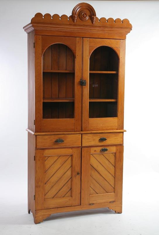 Appraisal: WALL CUPBOARD Pine with a carved cornice two glazed and