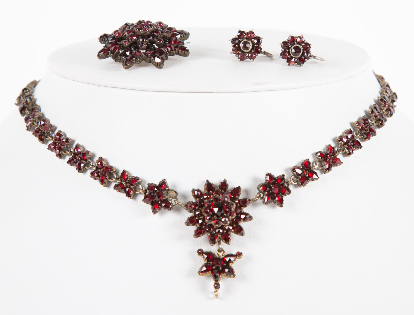 Appraisal: A German Silver and Garnet Suite including necklace brooch and