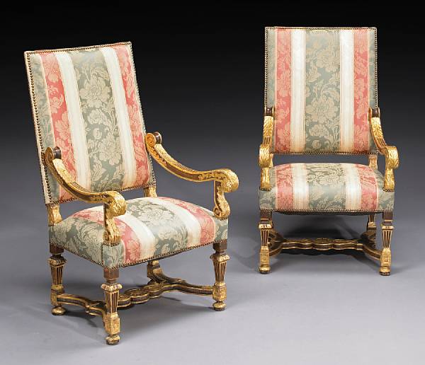 Appraisal: A pair of Louis XIV parcel gilt walnut fauteuils late