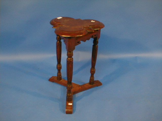 Appraisal: A Victorian oak trefoil jardiniere stand