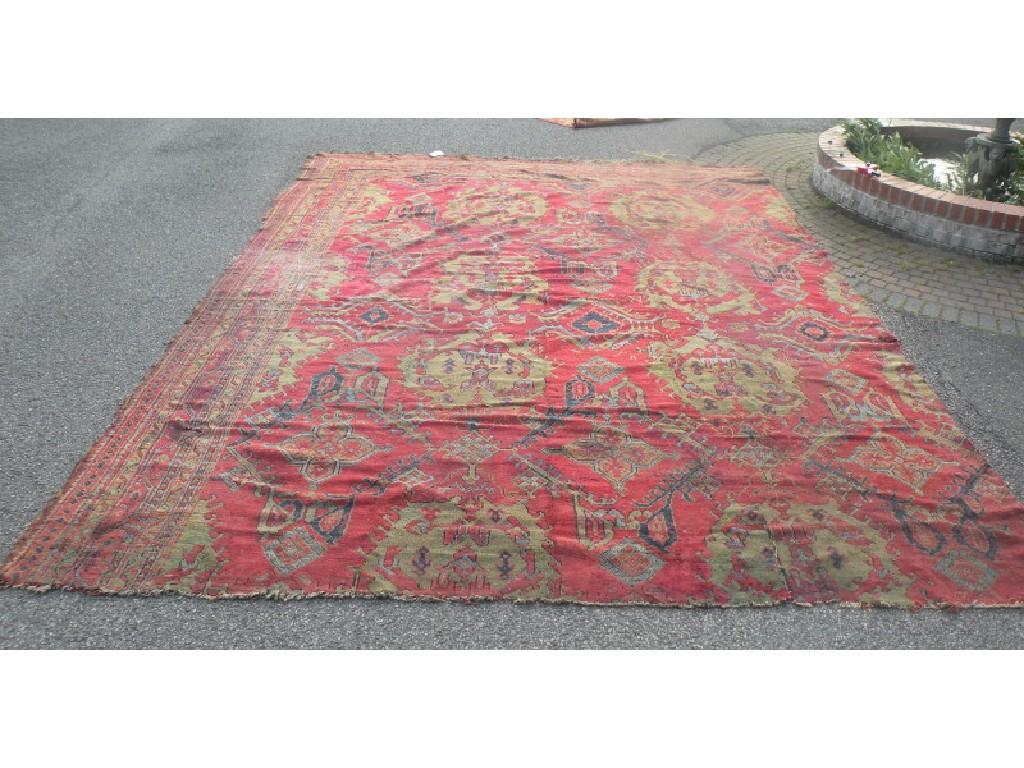 Appraisal: A large Turkish carpet with design of medallions on a