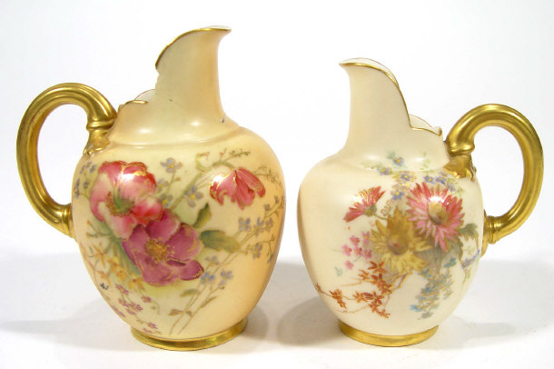 Appraisal: Two Royal Worcester blush ivory ground jugs both hand painted