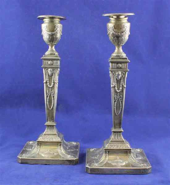 Appraisal: A pair of George V Adam style silver candlesticks with