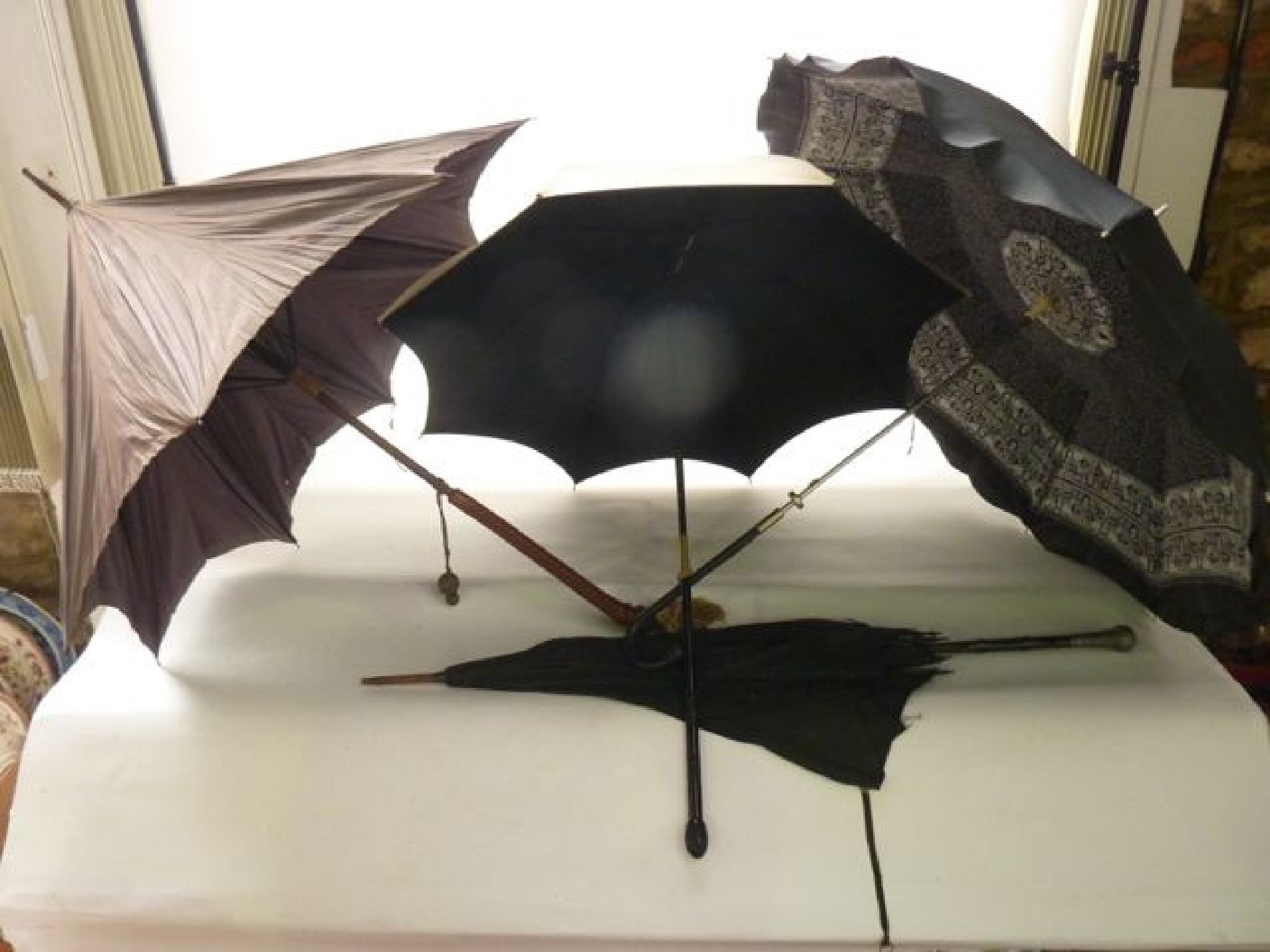 Appraisal: Four various vintage ladies parasols including an example with wrythen