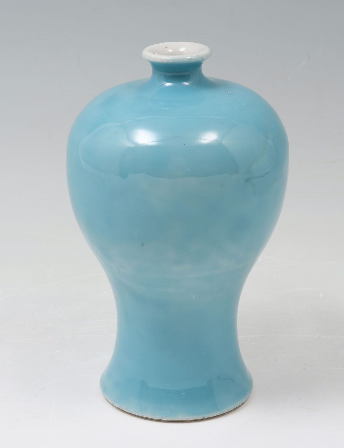 Appraisal: MONOCHROME CHINESE PORCELAIN MEIPING FORM VASE Variegated light blue glazed