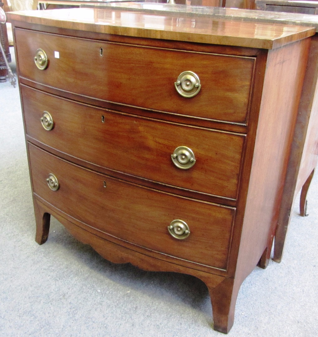 Appraisal: A Regency mahogany bowfront chest of three long graduated drawers