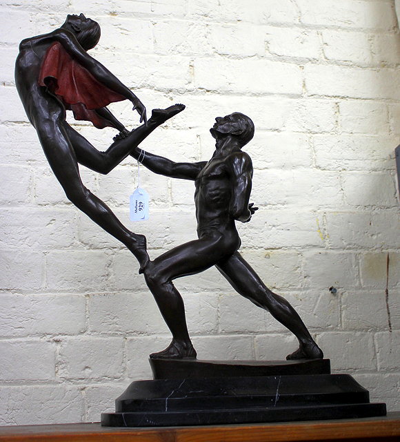 Appraisal: A BRONZE SCULPTURE OF TWO BALLET DANCERS mid leap mounted