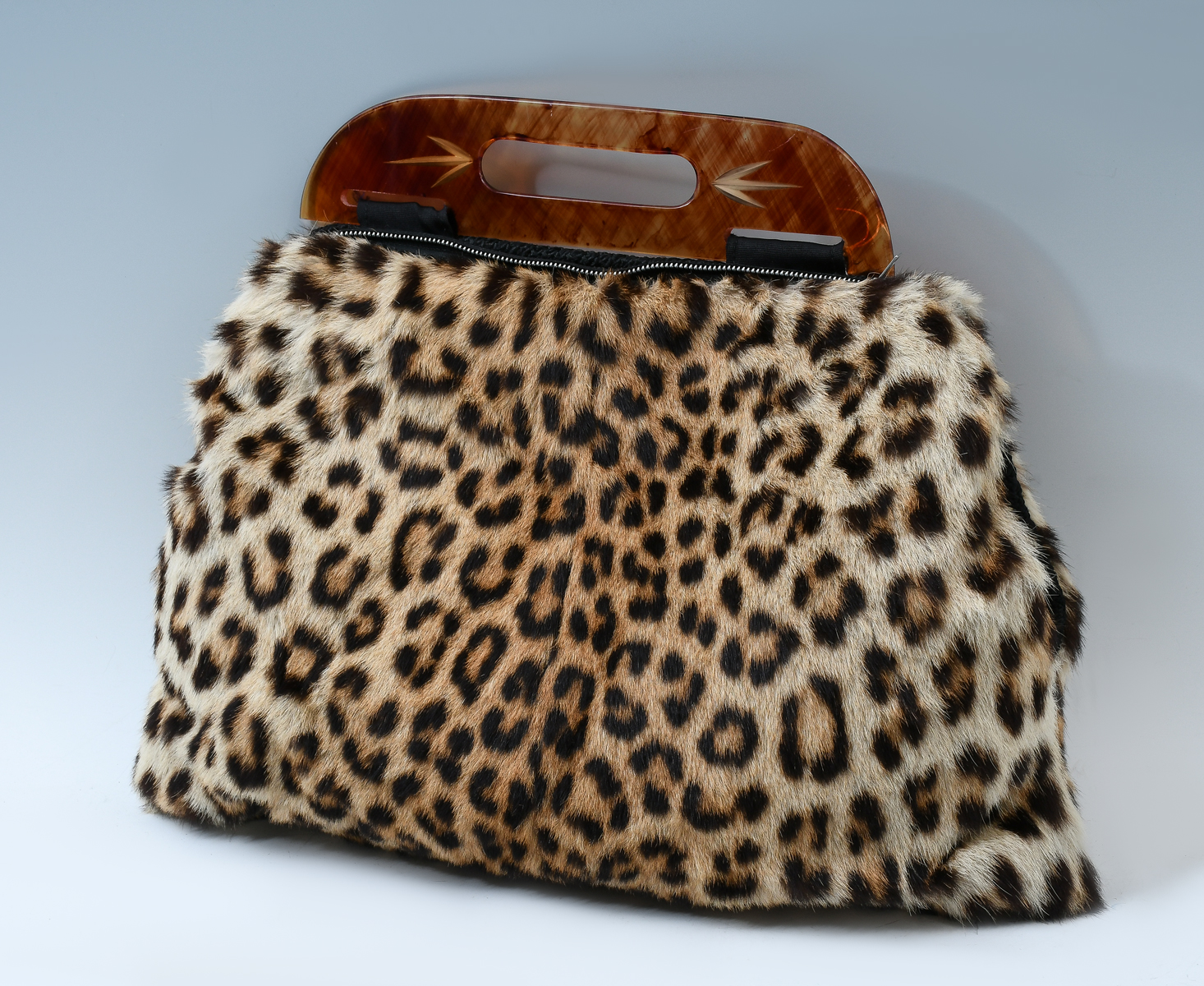 Appraisal: LEOPARD FUR PURSE MUFF WITH BAKELITE HANDLE Beautiful Leopard skin