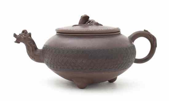 Appraisal: A Chinese Yixing Pottery Teapot of circular lidded form the