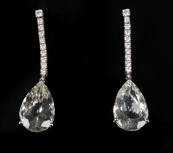 Appraisal: A pair of aquamarine and diamond pendent earrings the pear