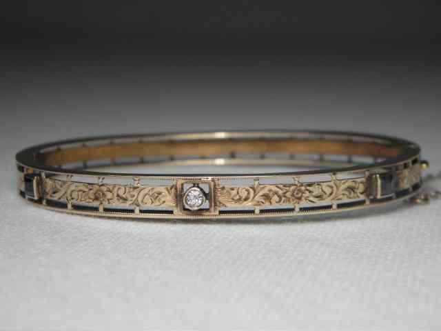 Appraisal: Antique k gold diamond and sapphire bangle bracelet Gold is