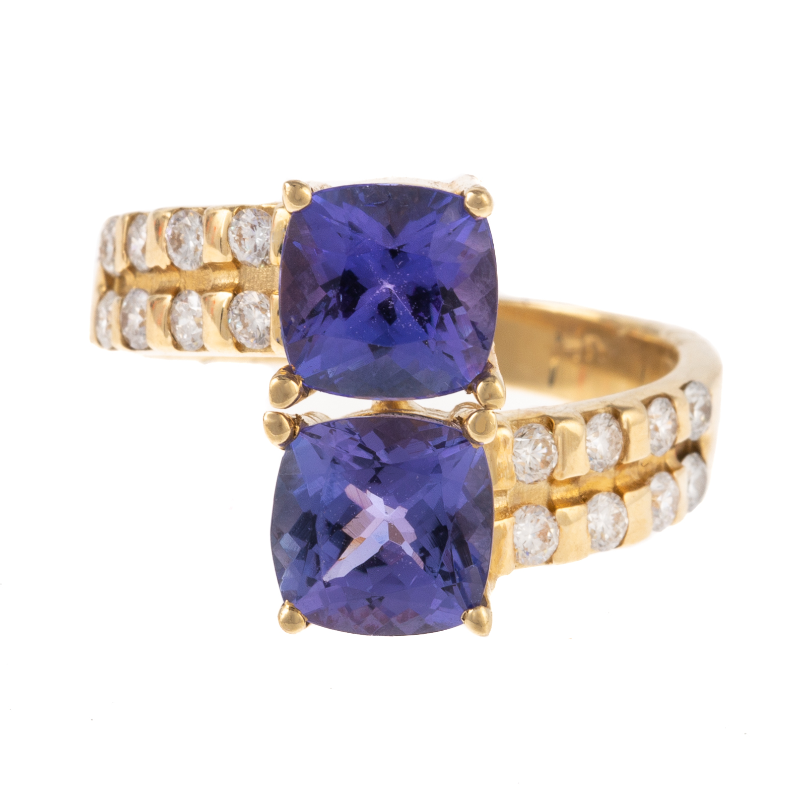 Appraisal: A TANZANITE DIAMOND BYPASS RING IN K K yellow gold