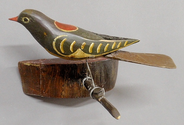 Appraisal: - Colorful carved and paint decorated bird late th c