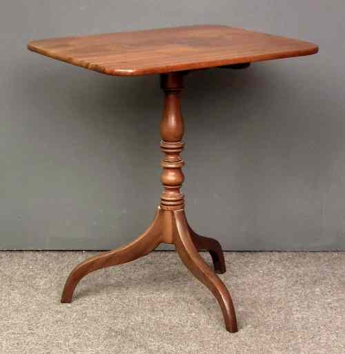 Appraisal: A late Georgian mahogany rectangular tripod table on slender turned