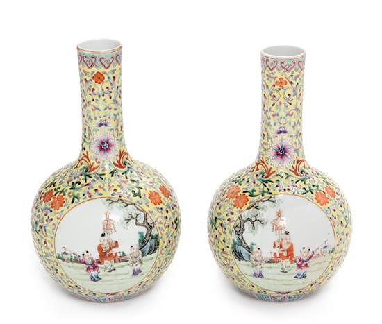 Appraisal: A Pair of Yellow Ground Famille Rose Porcelain Bottle Vases