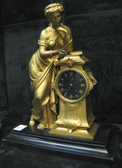 Appraisal: GOLD SPELTER STATUE CLOCK French late th century lady and