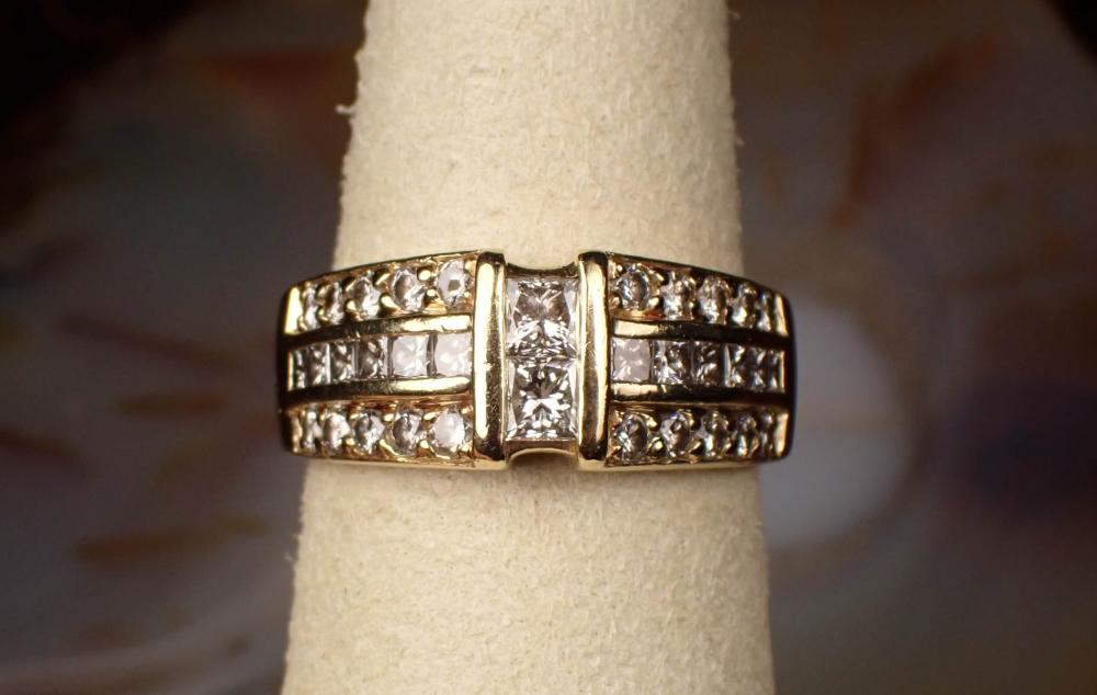 Appraisal: DIAMOND AND FOURTEEN KARAT YELLOW GOLD RING with six princess-cut