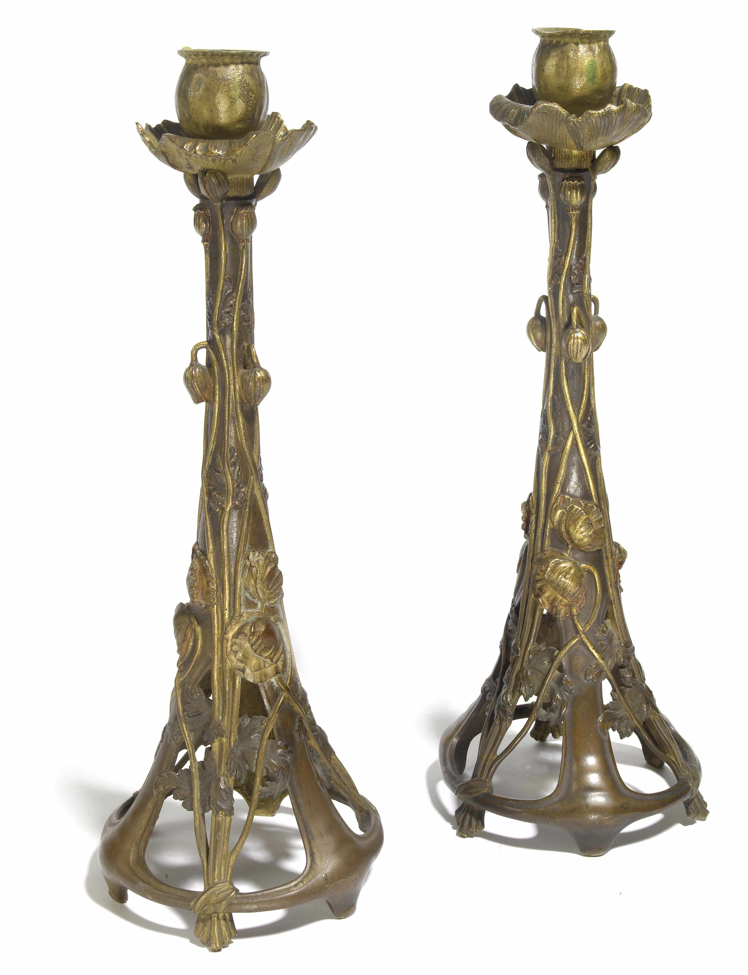 Appraisal: A pair of Art Nouveau parcel gilt bronze poppy candlesticks