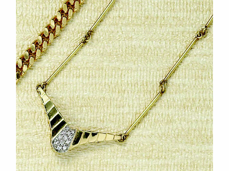 Appraisal: DIAMOND PENDANT k yellow gold fluted plaque set with twelve