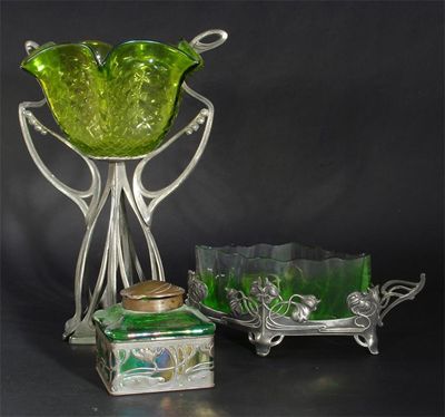 Appraisal: A Continental Art Nouveau pewter and glass centrepiece probably WMF